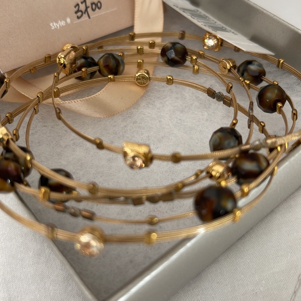 Whispers bracelet set.  New in box